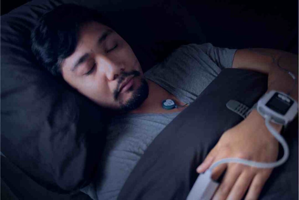 man-wearing-a-pulse-oximeter-at-home-sleep-study-test-for-sleep-apnea